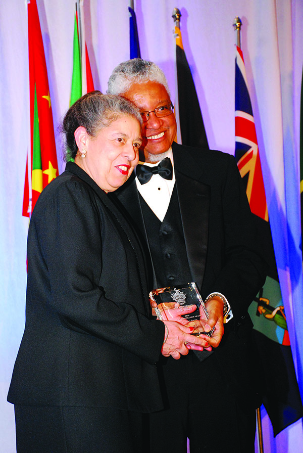 Dr. Dorothy Anna Jarvis receives her Vice Chancellor Award from Professor E. Nigel Harris. Photo by Heather Bubb-Clarke.