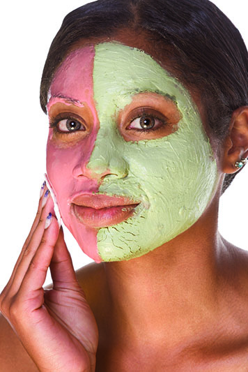 Black woman wearing facial mask -- © Can Stock Photo Inc