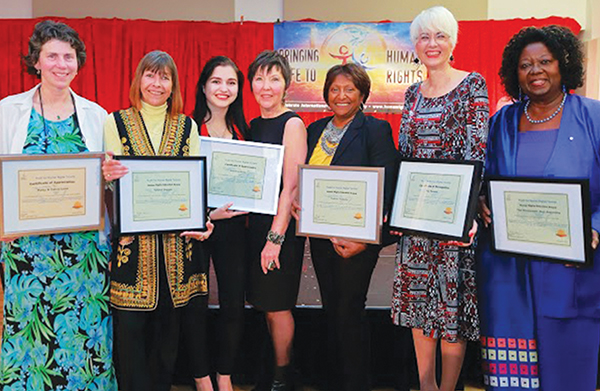 YHRI award recipients pose with the organisation’s Toronto Director (left to right): Patsy Lane, of Lane Veterinary, one of YHRI-Toronto’s major financial donors and supporters; Human Rights Education Award recipient, Tylaine Duggan, Founder of Youth Day Global; Kristina Kisin, Youth Achievement Award recipient; Nicole Crellin, YHRI -Toronto Director; Human Rights Education recipient, Padmini Padiachy, Vice-Principal with the York Region District School Board; Pat Felske, Director of Public Affairs for the Church of Scientology; the Hon. Jean Augustine, human rights advocate and former federal Cabinet Minister. Photo courtesy of YHRI-Toronto chapter.