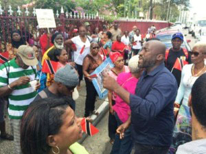 Supporters urge Port-of-Spain mayor not to resign. Phot credit: CMC.