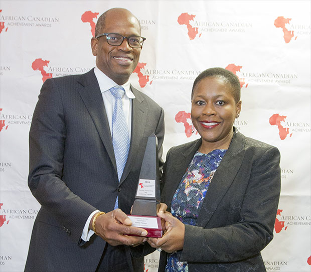 Anthony Stephen Benjamin, whose law practice, Benjamin Law, sponsored the African Canadian Achievement Awards' Excellence in Law award, earlier this year, presented the honour to recipient, Ontario prosecutor, Sandy Thomas. Photo credit: ACAA.