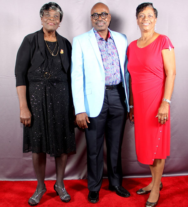 Grenada's Consul General Derrick James (centre) with Fifty-Five Plus Club President, Joan Charles (left) and Greta Best, Vice President. Photo by Harold Chitan.