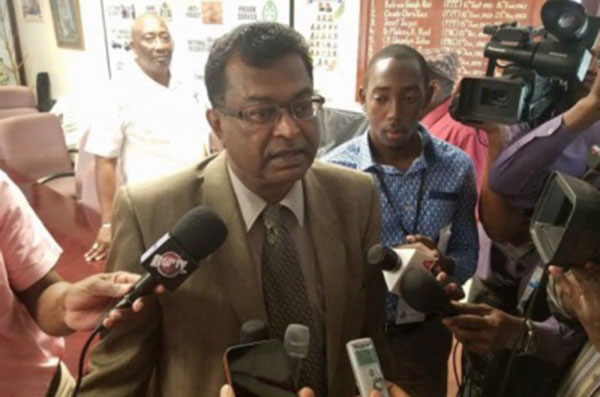 Guyana Public Security Minister, Khemraj Ramjattan, speaking to reporters.
