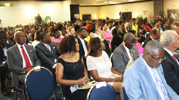 A cross-section of the huge audience pay rapt attention to the messages relayed by the speakers, including the Emcee for the evening, Earl Jarrett, the Chair of the Conference. Photo by Michael Van Cooten. 