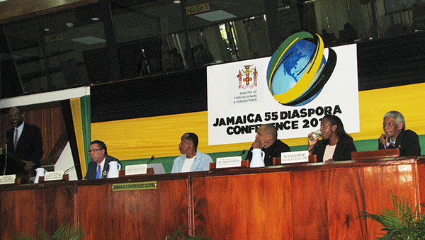 Moderator, Earl Jarrett, gives his opening remarks, while panelists (from left to right): Daryl Vaz, Minister, Michael Lee Chin, Dr. David Panton and Shanike Smart, and Professor Neville Ying (far right), Executive Director, Jamaica Diaspora Institute, listen attentively. Photo by Michael Van Cooten.
