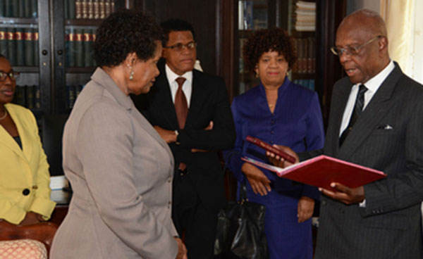Temporary Senator, Delisle Bradshaw, takes the oath of office before Governor General Dame Sandra Mason, while Clerk of Parliament, Pedro Eastmond, and Deputy Permanent Secretary, Cabinet Office, Harriette Sealy, look on. To the left is the Governor General's private secretary, Sandra Watkins. Photo credit: BGIS.
