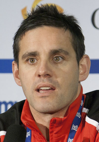John Herdman, former coach of the Canadian women's national team, pictured at a press conference, following Canada's 3-1 win over Mexico on January 27, 2012. Herdman, now head coach of the Canadian men’s soccer team, is part of Canada’s Gender Equity in Sport working group. Photo by Lord Bob - Own work, CC BY-SA 3.0, https://commons.wikimedia.org/w/index.php?curid=18199173.