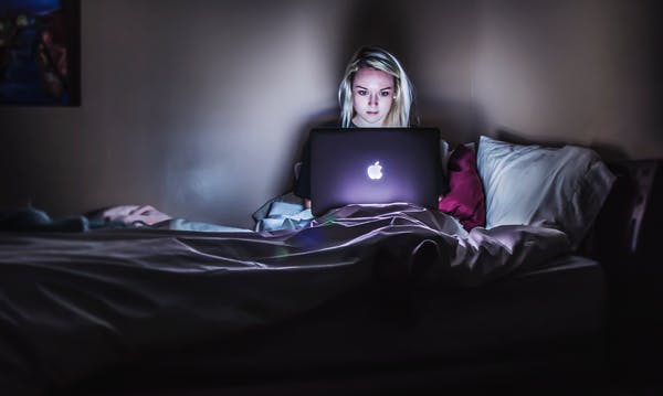 Get the electronics out of the bed! Photo credit: Victoria Heath/Unsplash.