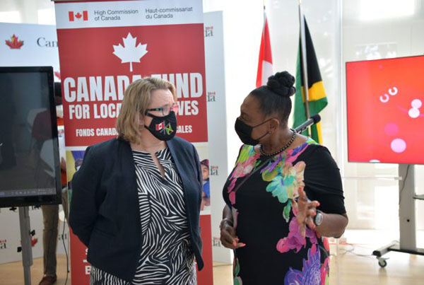 Jamaica's Culture, Gender, Entertainment and Sport Minister Grange (right) and Canadian High Commissioner Tudakovic, in conversation at the handover event in St. Andrew, yesterday. Photo credit: Yhomo Hutchinson.