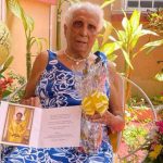 Barbados’ newest centenarian, Sylvia Elretta Springer, displays the birthday gifts she received from the President of Barbados, Dame Sandra Mason. Photo credit: T. Barker/BGIS.