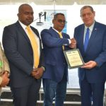 Jamaica's Minister of Transport and Mining, Audley Shaw (second from right), presents a plaque to President, Quality Corporate Aircraft Services (QCAS) Aero, Ronald Sammy (third from left), to commemorate the inaugural Quality Corporate Aircraft Services (QCAS) Aero flight out of Fort Lauderdale to the Ian Fleming International Airport, recently. Also pictured (from left) are: President, Airports Authority of Jamaica (AAJ), Audley Deidrick; Director of Business Development, QCAS Aero, Andrew Nicholson; and Member of Parliament, St. Mary Western, Robert Montague. Photo credit: Yhomo Hutchinson/JIS.
