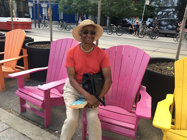 Kamala-Jean Gopie relaxing outside the Roy Thomson Hall in Toronto, Ontario. Photo credit: Neil Armstrong.
